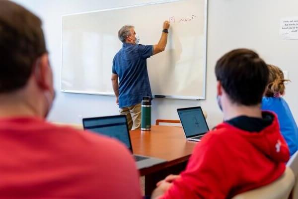 Henkel Family Chair in International Affairs and Professor of Political Science Eric K. Leonard, Ph.D., teaches a class in Davis Hall.